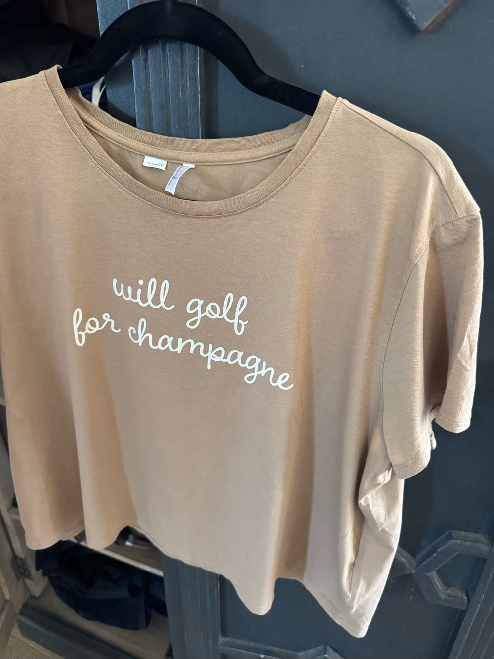 Travis Mathew Tan Short Sleeve Tee with "will golf for champagne" Script